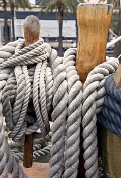 ropes of different sizes fastened around wooden cleats