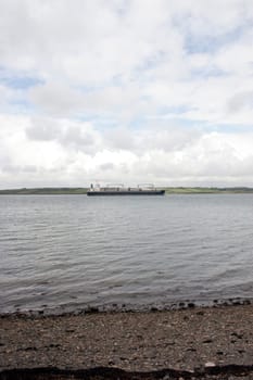 cargo ship with windmill parts on its journey through Youghal harbour county Cork Ireland