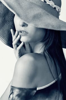 Glamour of Asian beauty with hat, closeup portrait.