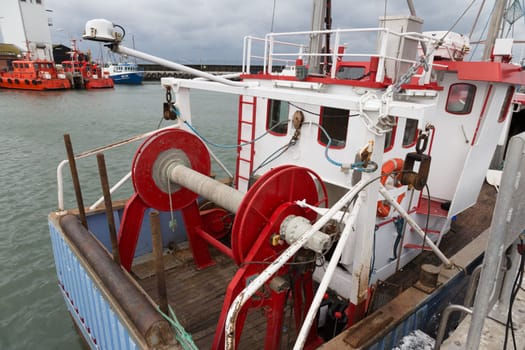 Stern of a fishing boat with rope drum and cabin