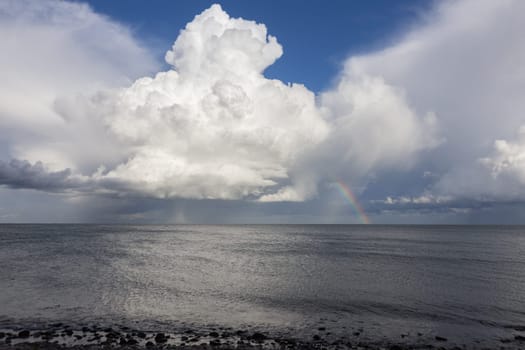 A huge pile cloud rises high above the Baltic Sea