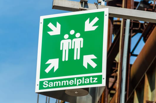 Green sign with caption collection point