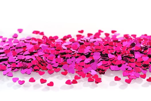 Detailed view of many small pink glitter hearts