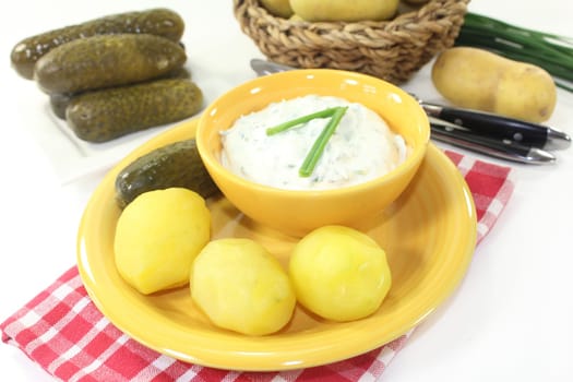 Herbal quark with peel potatoes and sour cucumber