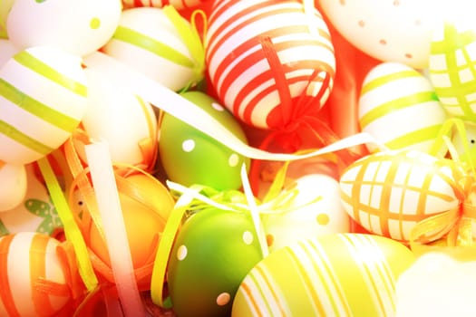 many colorful Easter eggs in a nest as decoration