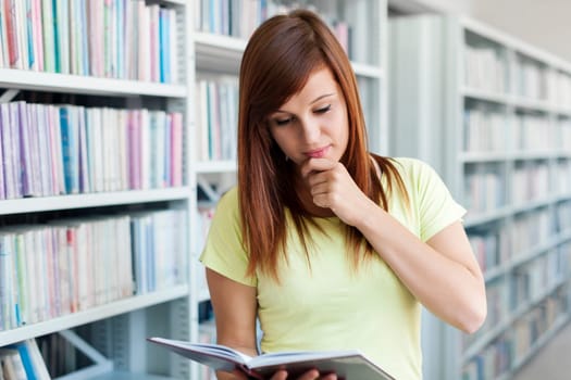 Student reading in library