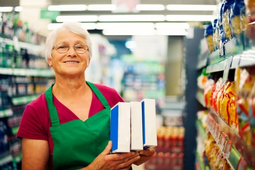 Senior woman working at supermarket