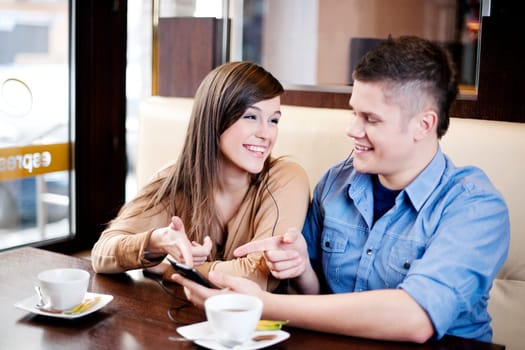 Couple listening music in cafe