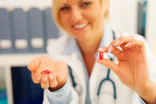Medical female doctor giving pills