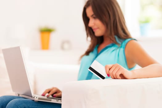 Young woman making internet payment