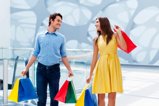 Happy couple after successful shopping