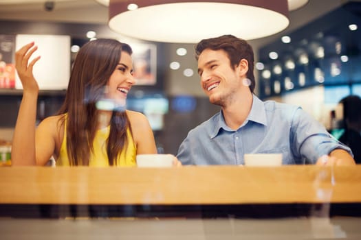Happy couple have fun in cafe