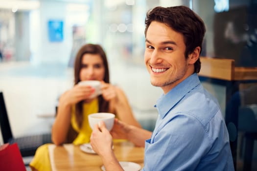 Smiling handsome man at a meeting