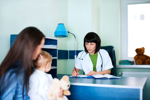 Mother and baby girl at the doctors office