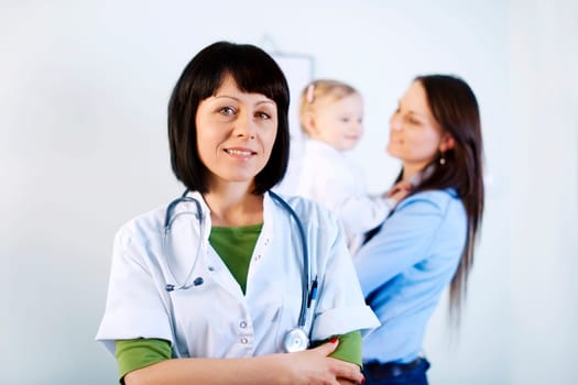 Smiling doctor holding notes