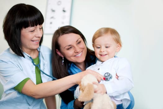 Doctor examining child