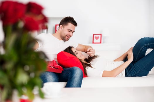 Man feeding his girlfriend chocolates