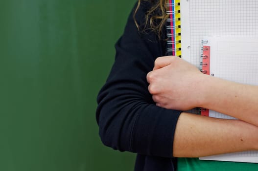 Student girl holding notebooks