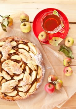 Homemade apple pie with organic apple chimes and tea