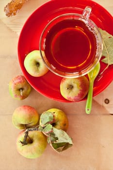 Organic fruechtetee with apple in glass cup