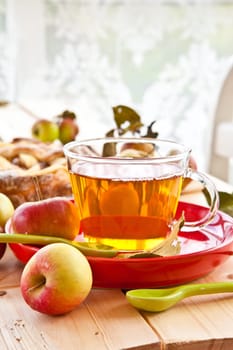 Organic fruechtetee with apple in glass cup