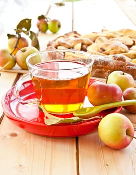 Organic fruechtetee with apple in glass cup