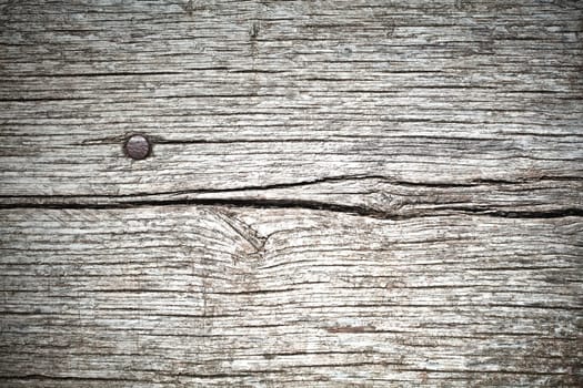 Background composed of planks of old wood and a nail
