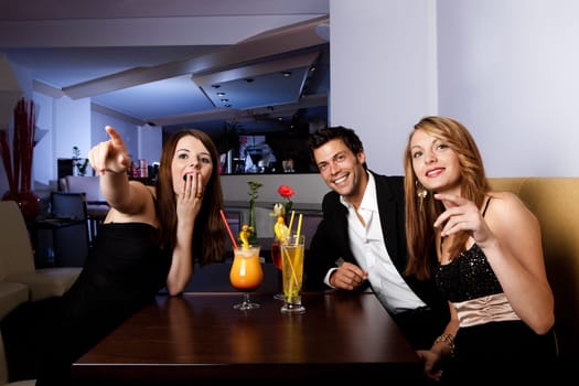 Group of friends enjoying show. Focus on women on the left