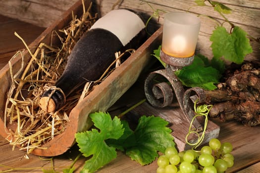 Wine bottle in clay brick by candlelight