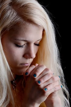 young woman prays