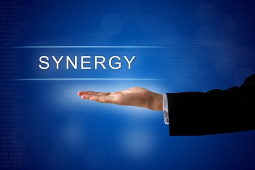 synergy button with business hand on a touch screen interface