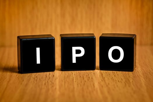 IPO or Initial public offering text on black block