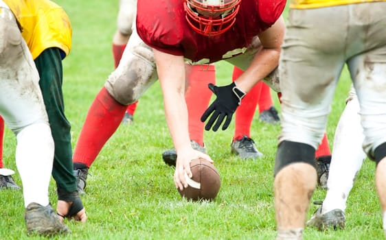 American football game in rain