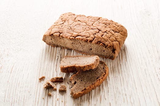 whole grain bread on white wooden background
