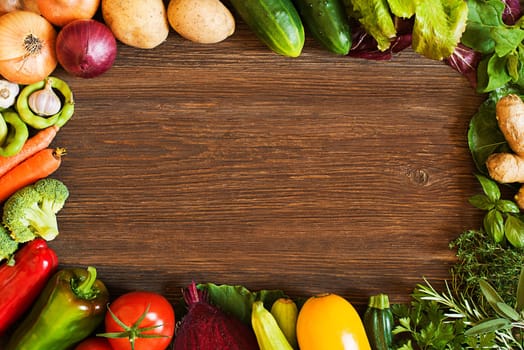 Vegetables on old wooden background overhead close up shoot