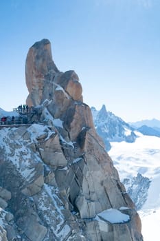Mont Blanc mountain range, In Chamonix, France, with climbers on its rocks