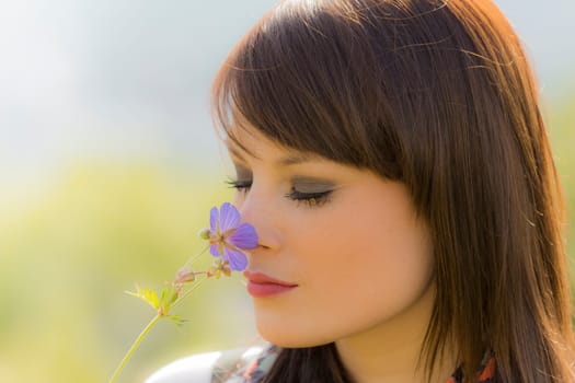 The young woman enjoys the beauty of nature. Wonderful picture with nice colors.