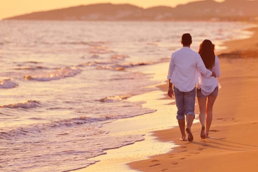 happy young romantic couple in love have fun on beautiful beach at beautiful summer day