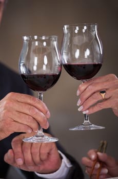 Happy Mature Couple Toasting Wine In A Elegant Restaurant