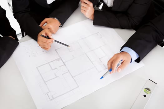 Group of architects at the meeting discussing the project