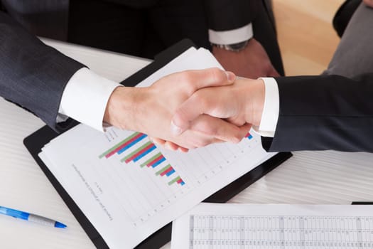 Close Up Of Two Business People Shaking Hands