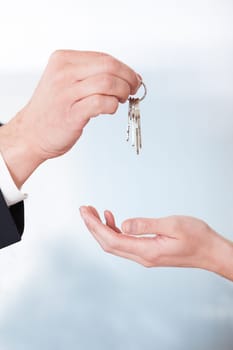 Consultant Giving Keys To Woman In Office