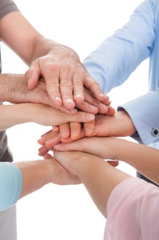 Close-up Of Hand Stacked Over Each Other On White Background