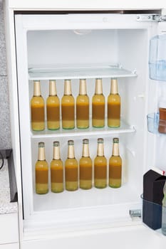 Bottles of alcoholic beer kept in a row