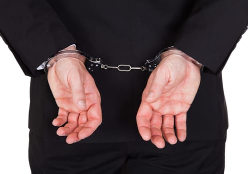 Rear view of arrested businessman with handcuffs