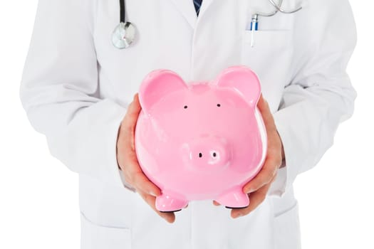 Happy Young Male Doctor Holding Piggy Bank Over White Background