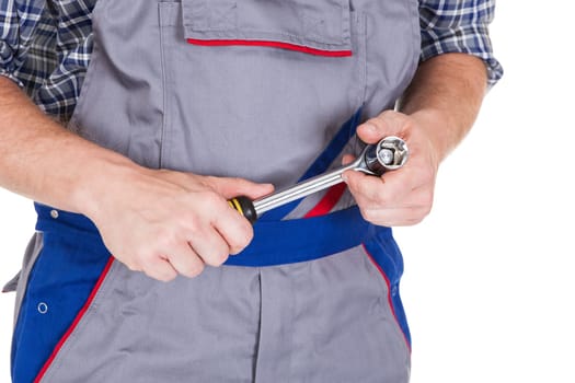 Male mechanic holding ratchet isolated on white background