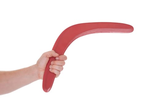 Close-up Of Male Hand Holding Boomerang Over White Background
