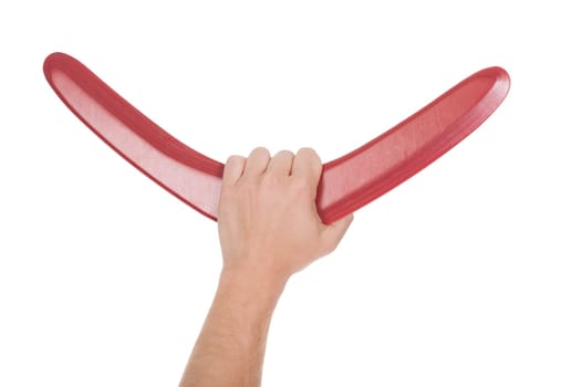 Close-up Of Male Hand Holding Boomerang Over White Background