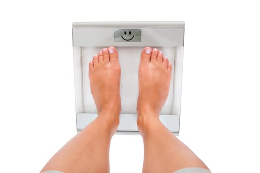 Close-up Of Woman's Feet Measuring Weight Over White Background